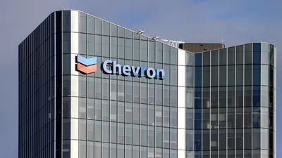 The Chevron logo displayed on the glass exterior of the company's Australian headquarters at Elizabeth Quay in Perth. 
