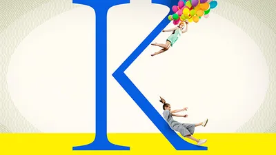 Two people float or slide along a large blue letter K, one holding colorful helium balloons, against a white and yellow background.